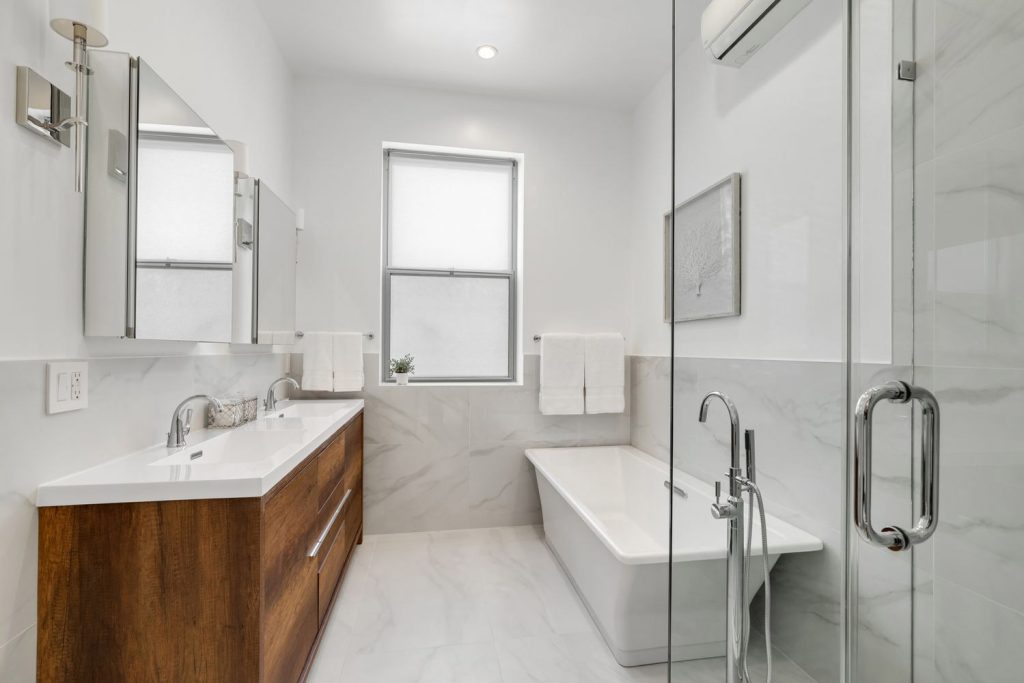 An upscale white bathroom renovation