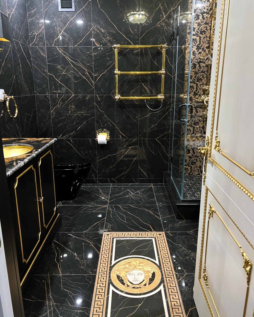 A dark, luxurious bathroom remodel with royal detailing