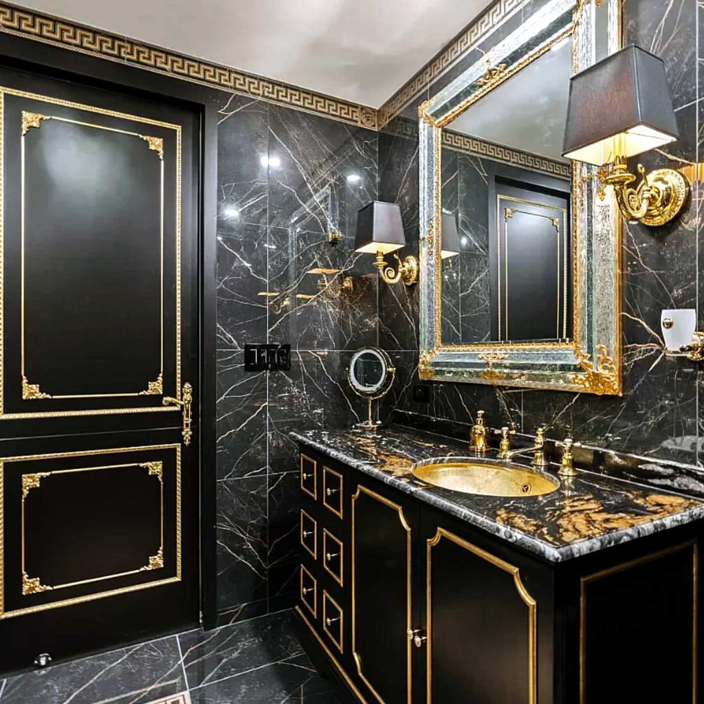 A dark, luxurious bathroom remodel with royal theme and gold detailing