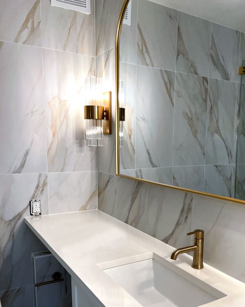 A luxury bathroom in gold leaf marble