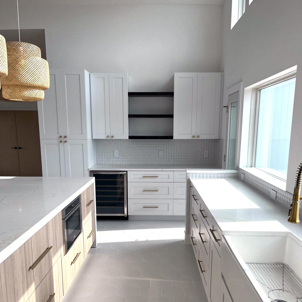 A stunning kitchen renovation featuring a wine fridge