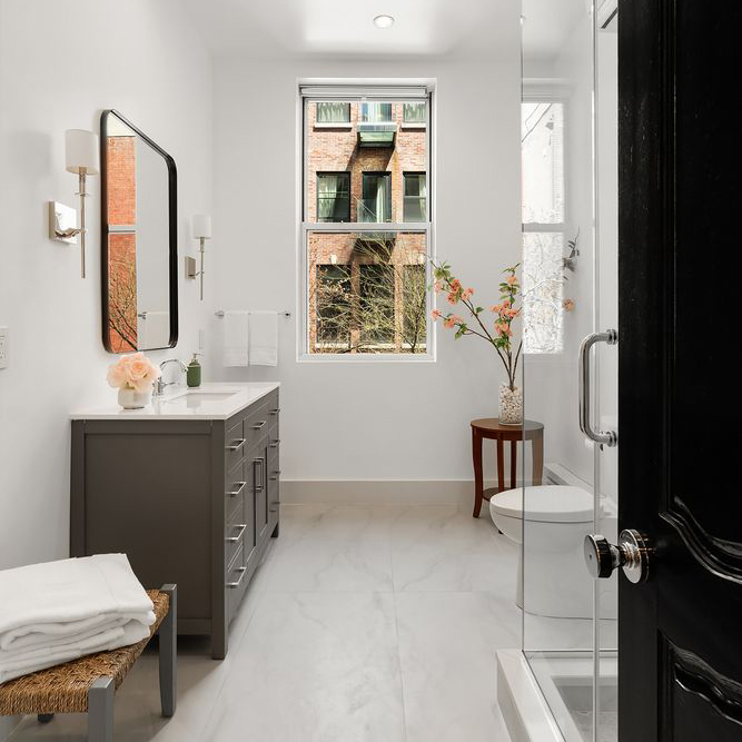 An all-white, newly renovated bathroom