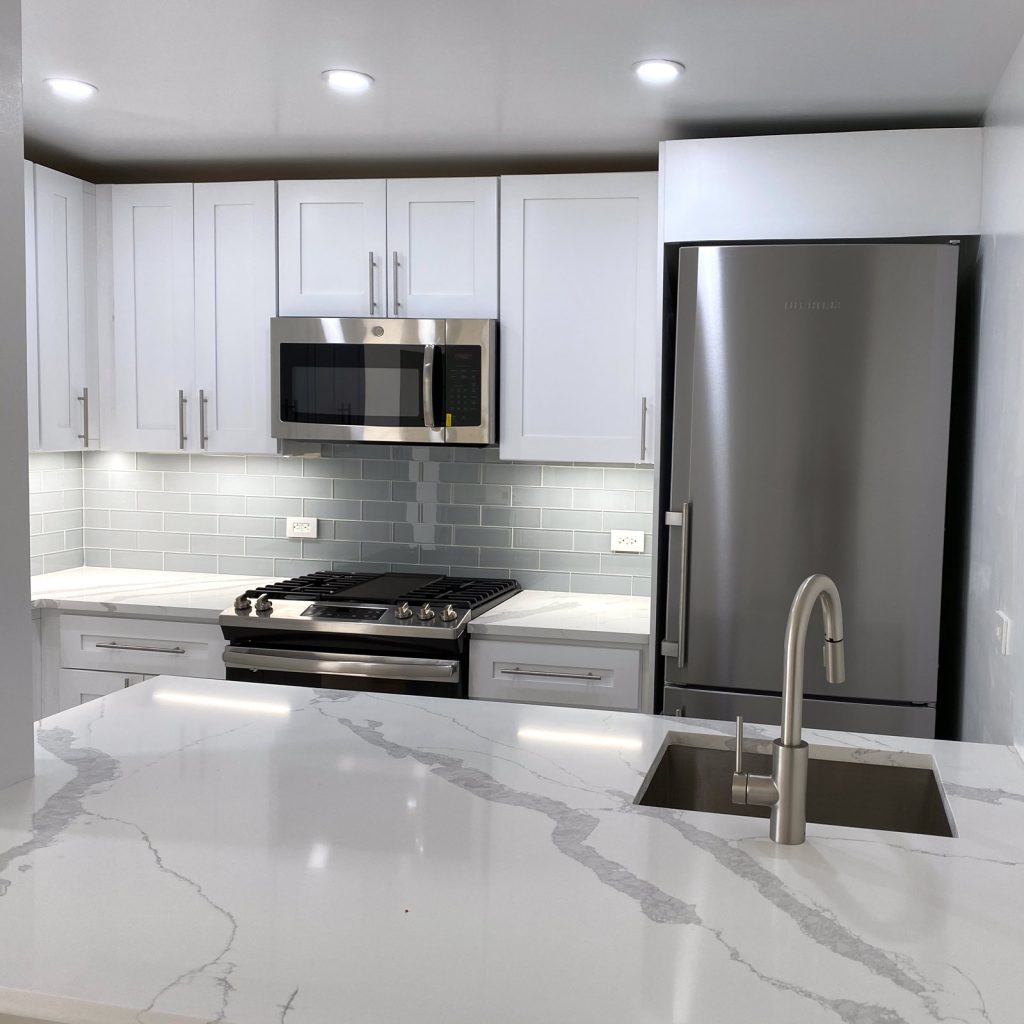 A sleek gray remodeled kitchen